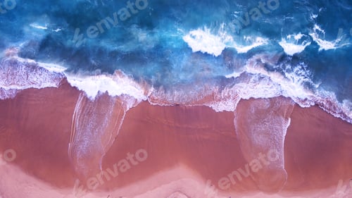 Preview: Blue sea water wave on pink beach sand