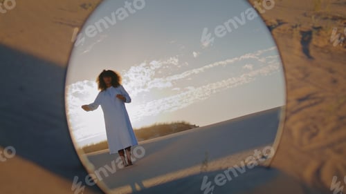 Preview: Mirror reflecting woman dance at sand desert in front sunset. Girl performance.