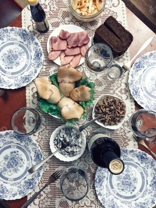 Preview: Festive Food Table Setting with Mushrooms and Bread