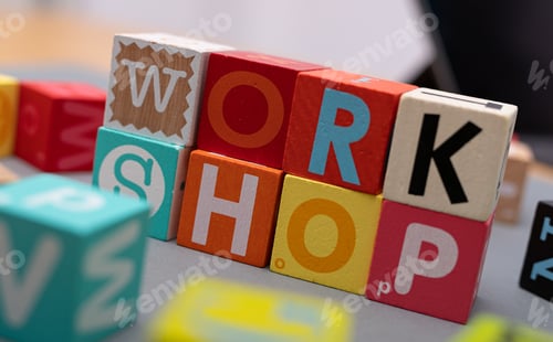 Preview: Closeup shot of colorful letter cubes forming the word workshop