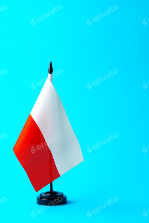 Preview: Small flag of Poland on flagpole on blue background