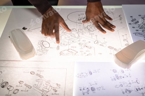 Technical Drawings with Car Model and Human Hands