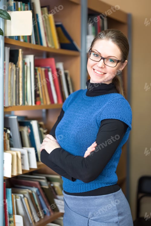 Preview: Positive Woman With Glasses In Library