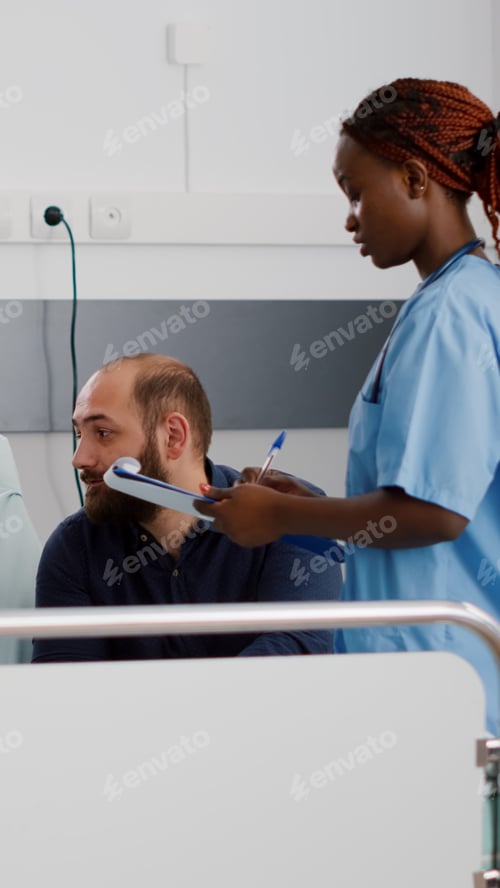 Preview: African american pediatrician asisstant monitoring sick patient discussing medicine treatment