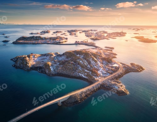 Preview: Aerial view of bridge over the sea and snowy mountains