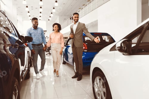 Preview: Seller Showing Luxury Car Consulting Couple In Dealership Shop
