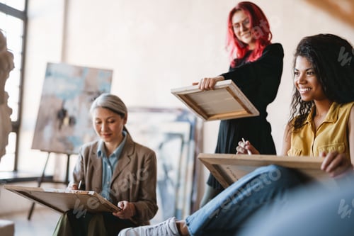 Preview: Young multiracial students drawing plaster bust in art school