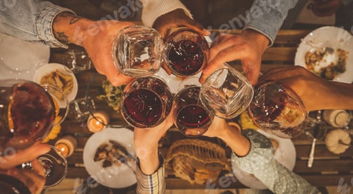 Preview: Family and friends celebrating at dinner on a rooftop terrace