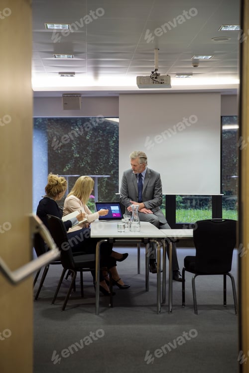 Preview: Colleagues in conference room having meeting
