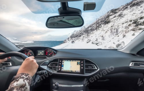 Preview: Hand holding steering wheel in luxury private car, Driving in rural road on winter