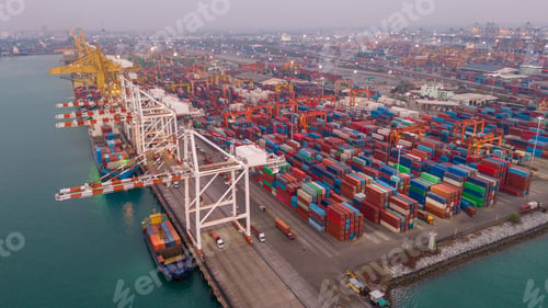 Preview: Crane loading box container to cargo ship at commercial dock port. Shipyard Cargo Container Sea Port