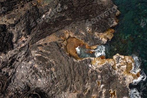 Preview: Rocky coast washed by foamy waves