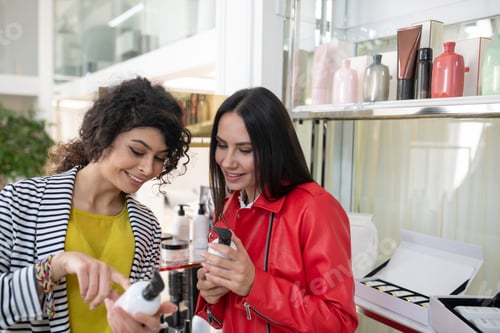 Preview: Two beaming ladies choosing hair care products