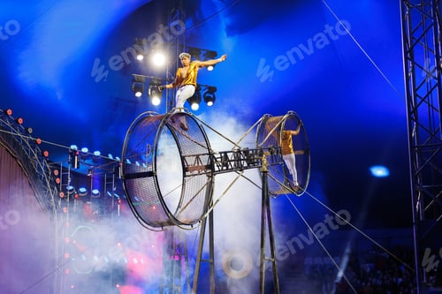 Preview: Brave male acrobats in the rotating wheel of death perform under the dome of the circus.