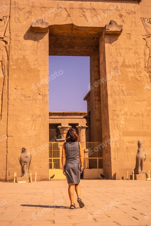 Preview: A Young Tourist Leaving The Edfu Temple Near The Nile River In Aswan. Egypt, Return Of Tourism In
