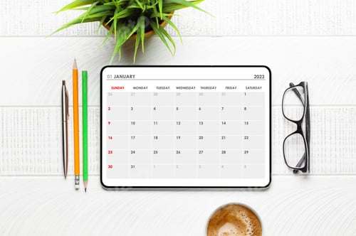 Preview: Tablet with calendar app, coffee cup and office supplies