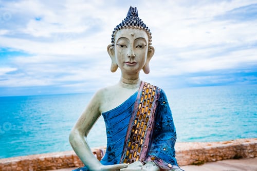 Preview: Sculpture of a meditating yogi in white clay and blue tones with the face of Buddha
