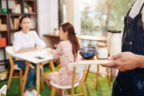 Preview: Waiter carrying tray with breakfast