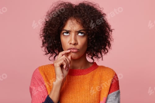 Preview: Thoughtful pondering counting concentrated african american woman