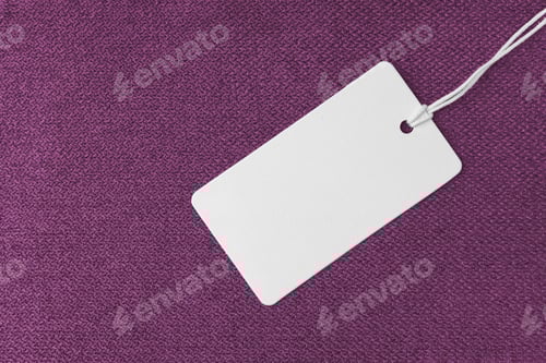 Preview: Blank White Tag on a Purple Fabric Background