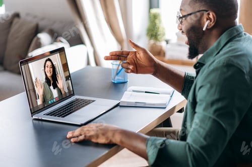 Preview: Man on Video Call with Woman on Laptop