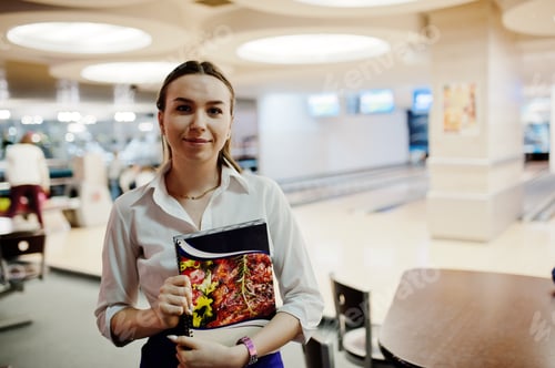 Preview: Waiter girl holding menu at cafe. People and service concept