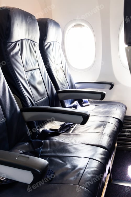 Preview: Black leather seats for passenger in economy class cabin and the seat belt for securing.