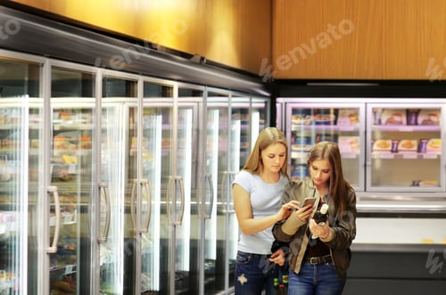 Preview: Choosing Frozen Food From A Supermarket Freezer