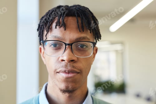 Preview: Young Man Wearing Glasses Portrait Indoors