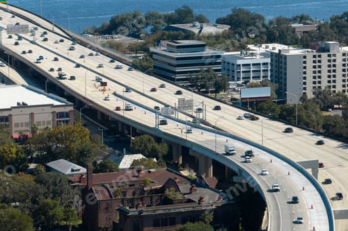Preview: American freeway intersection with fast driving cars and trucks.