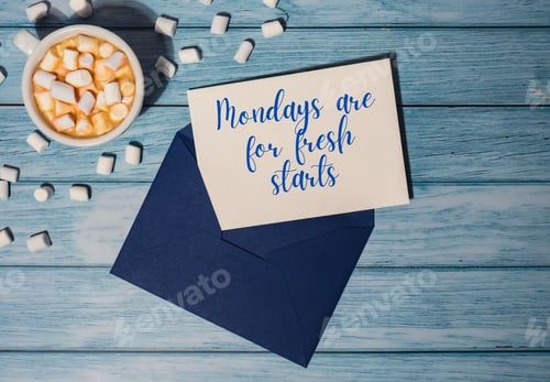 Preview: MONDAYS ARE FOR FRESH STARTS concept text blue envelope with white cup of coffee and marshmallows on