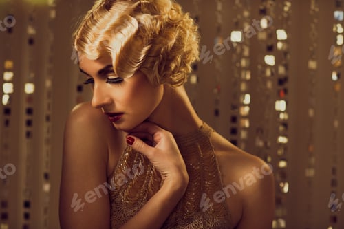 Preview: Elegant blond retro woman in golden dress with beautiful hairdo and red lipstick