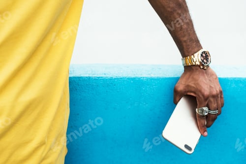 Preview: African man holding a smart phone