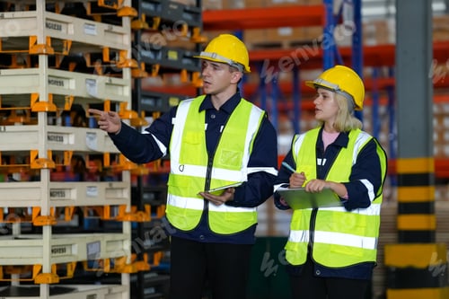Preview: Young warehouse workers working together. Business distribution supply and logistic shipment.