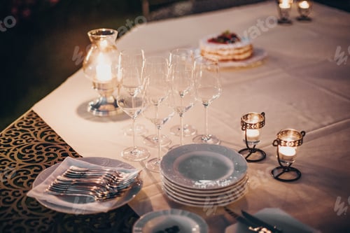Preview: Wedding table with candles, cutlery and plates, champagne drink and glasses