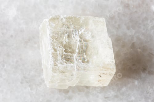 Preview: sample of raw iceland spar mineral on white marble