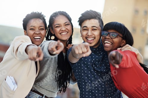 Preview: Join us today. Portrait of a group of happy students pointing toward the camera.