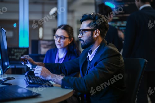 Preview: diverse team of AI developers shares a successful moment in the office.