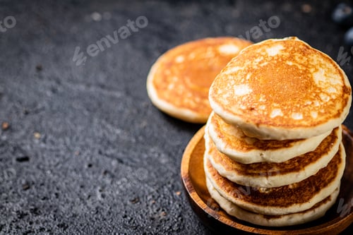 Preview: A pile of homemade pancakes in a plate on the table.