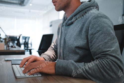 Preview: Young man working in a tech environment