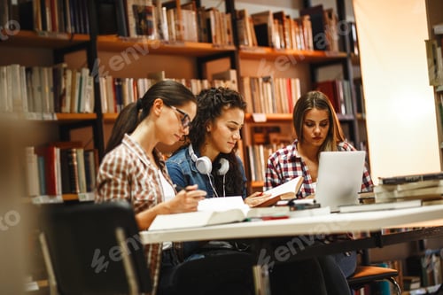 Preview: Group of female students study in the college library.