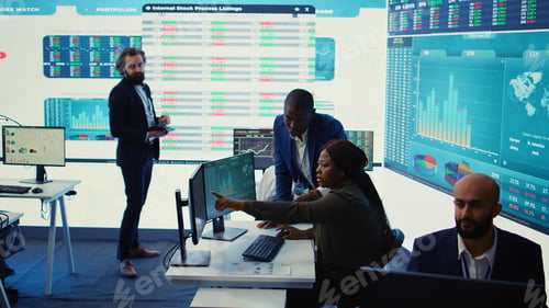 Preview: Business associates evaluating key performance indicators within the company
