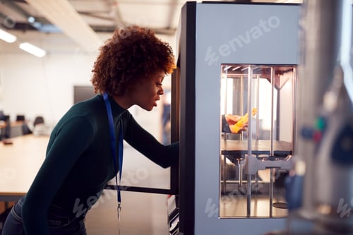 Preview: Female College Student Studying Engineering Using 3D Printing Machine