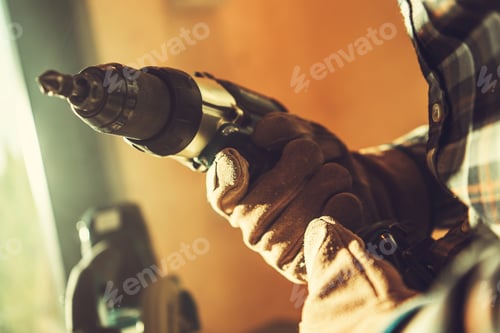 Preview: Worker with Drill Driver in His Hand Close Up