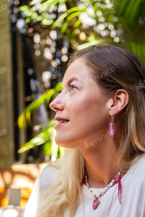 Preview: Smiley female portrait in sunshine.