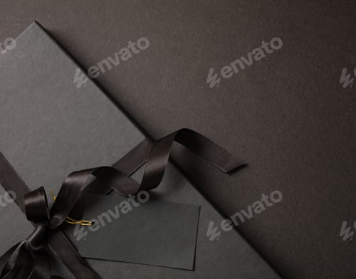 Preview: Black Friday sale concept, Gift box with ribbon bow on black background