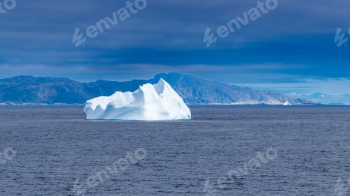 Preview: Iceberg floating by mountains