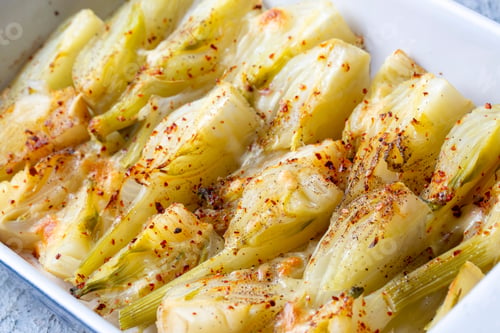 Preview: Organic Baked Fennel Bulbs with Salt and Pepper. Fennel dish with olive oil.