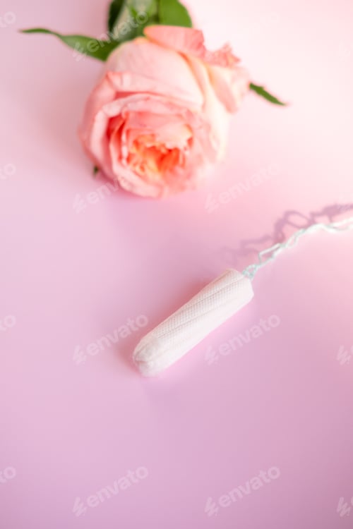 Preview: white tampon and pink rose, On a pink background,copy space