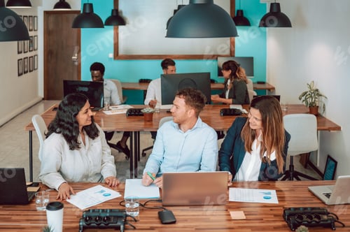 Preview: Colleagues working together in office